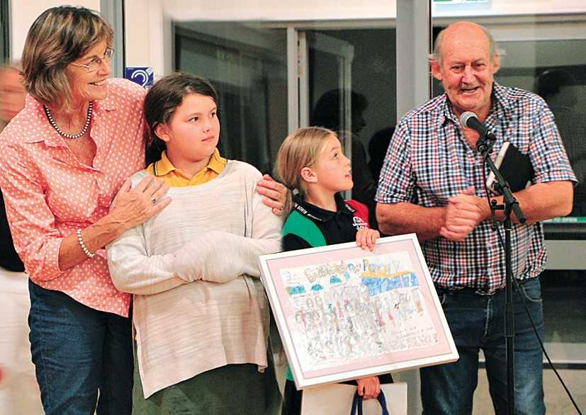 Gypsy Beatty and Susan Schmidt present their hand-drawn picture to Rosie and Tony Stewart 