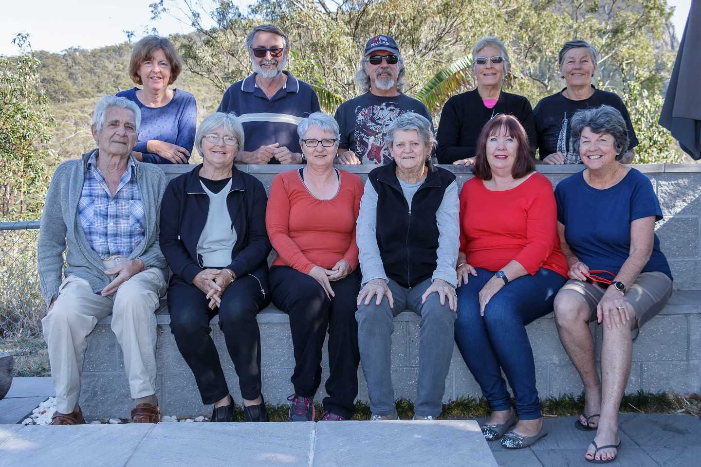 Tin Can Bay Camera Club's Lake Moogerah Retreat Group in the front row: Frank Posch, Cathy Reed, Julie Hartwig, Jan Blackshaw, Maree Davies, Patsy Brady; and back row: Chris Harvey, Ron Johnson, Harry Duncan, Lyn Mary Boyce, Lyn Minchell