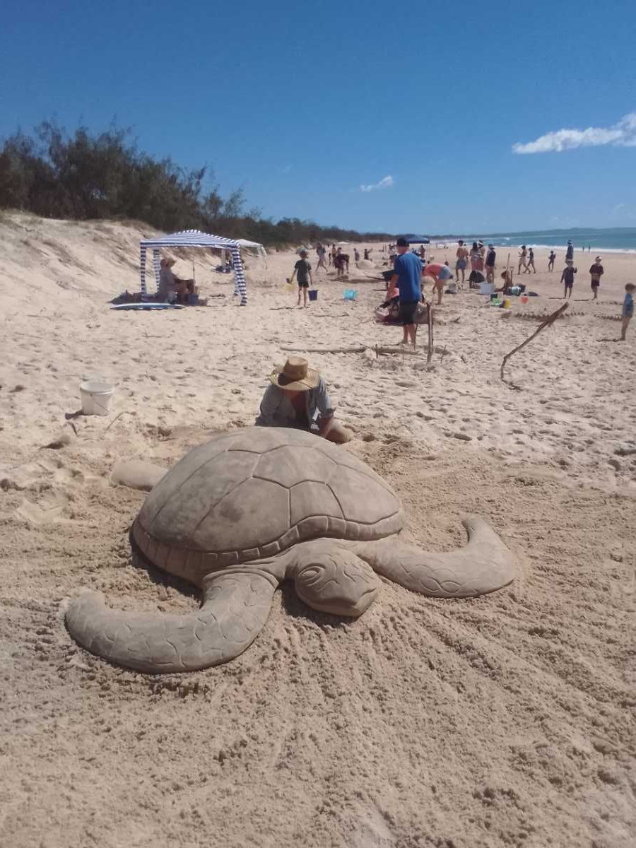 Arron of Sandshapers with his amazing turtle sand sculpture