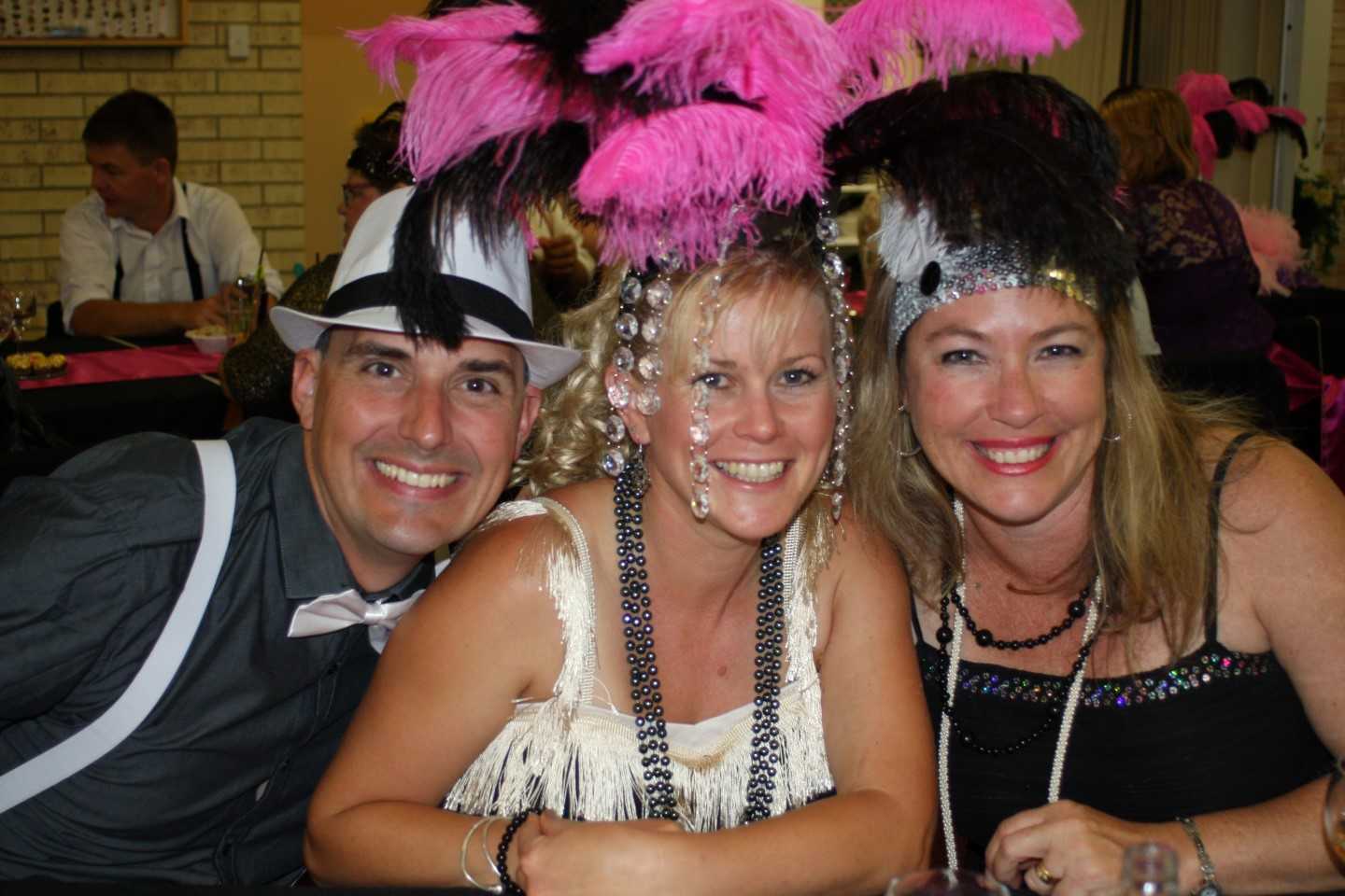 Pink and black feathers themed up the tables, and Yvonne Jensen didn't mind borrowing it to glam up further with husband Russ