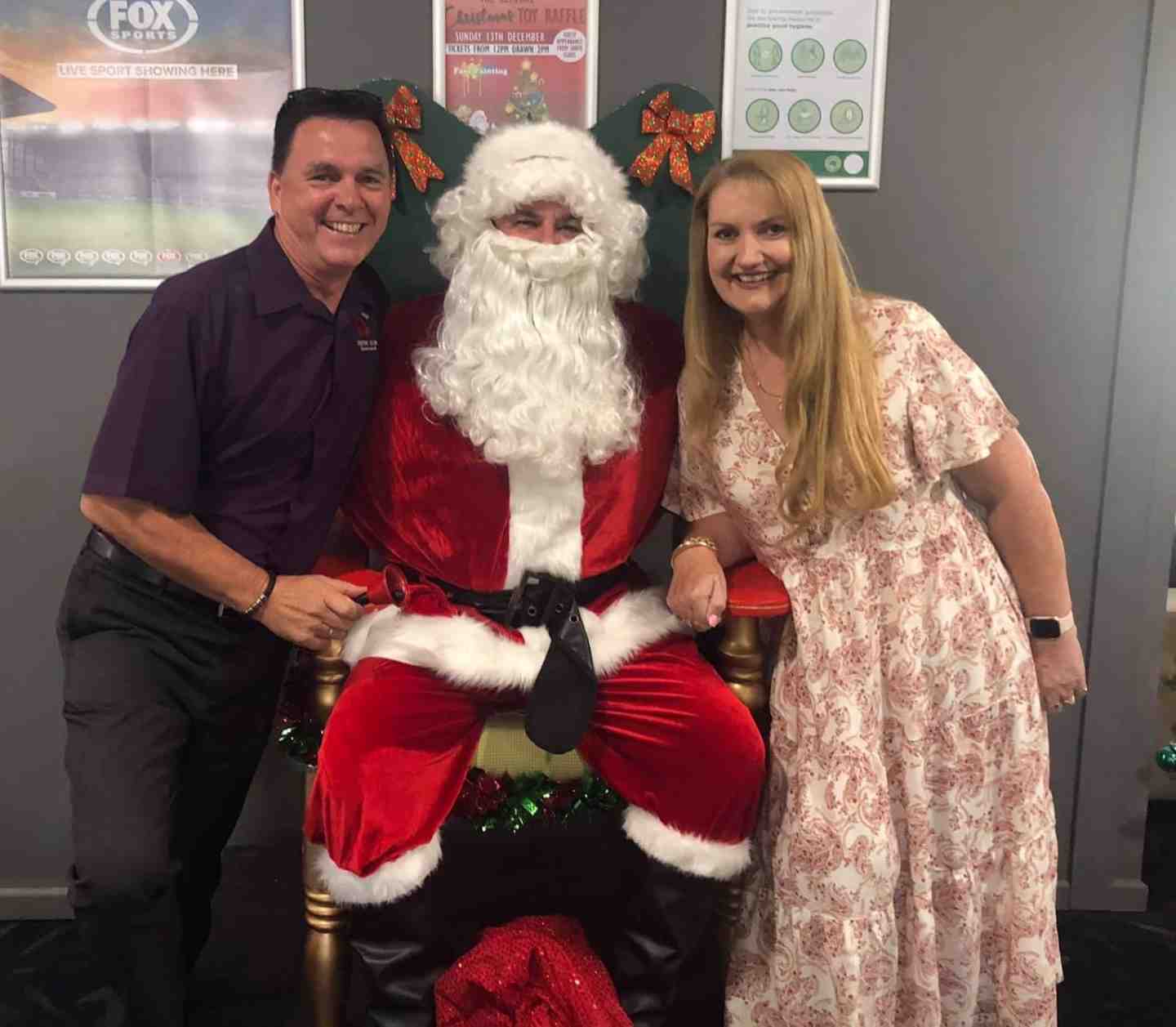 Tin Can Bay Country Club Manager Brad Robb and his wife, Heather, helped Santa Claus this year, and they thank everyone who bought a ticket in the raffle 