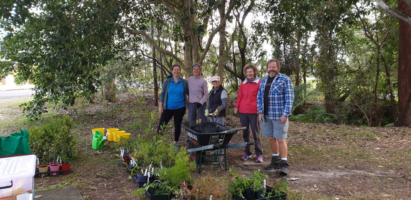 L-R Jess Milne (Weed Warriors Team Leader), Linda Tabe (Vice President), Julie Venn, Ferne Tabe, and Rod Hutchinson preparing the tools and plants ready for planting by Ben Galea