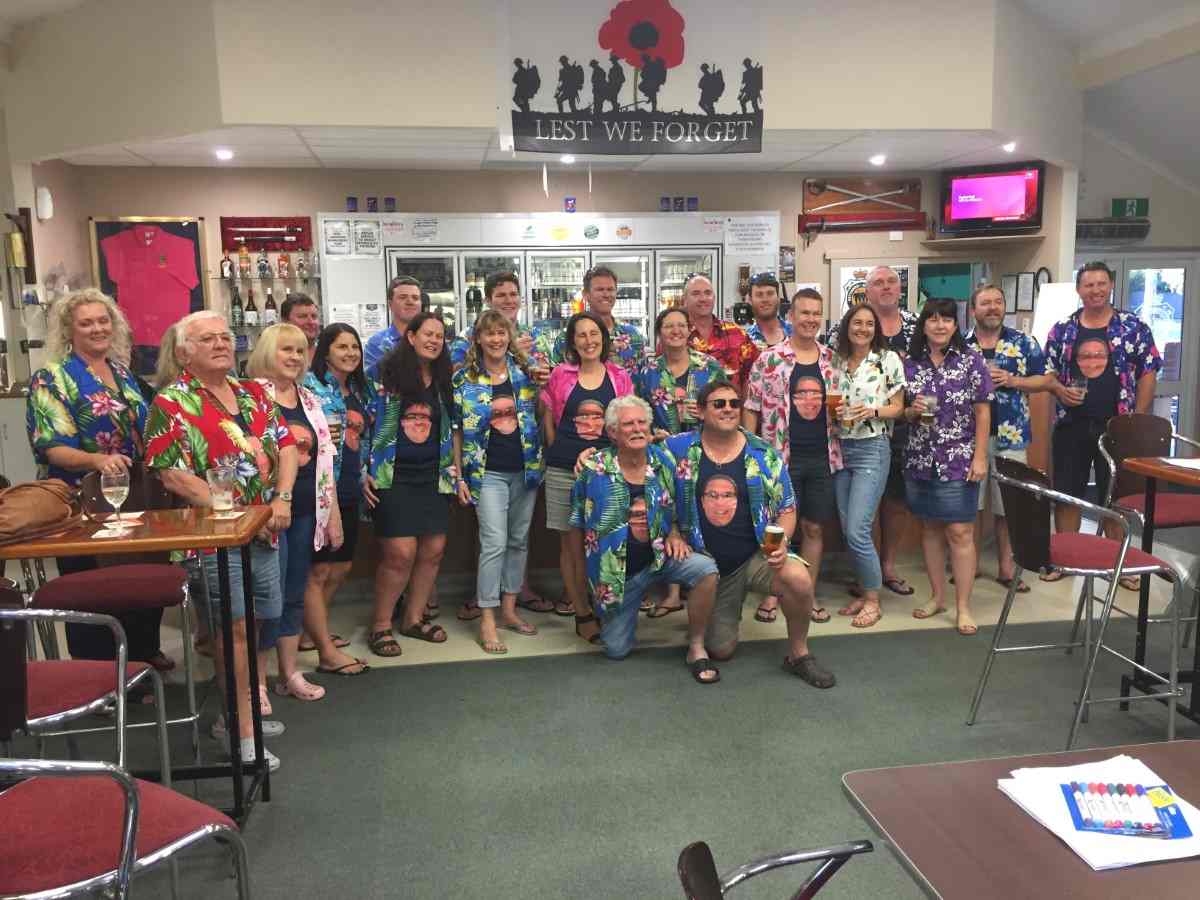 Birthday celebrations being enjoyed by a colourful crowd at the Tin Can Bay RSL