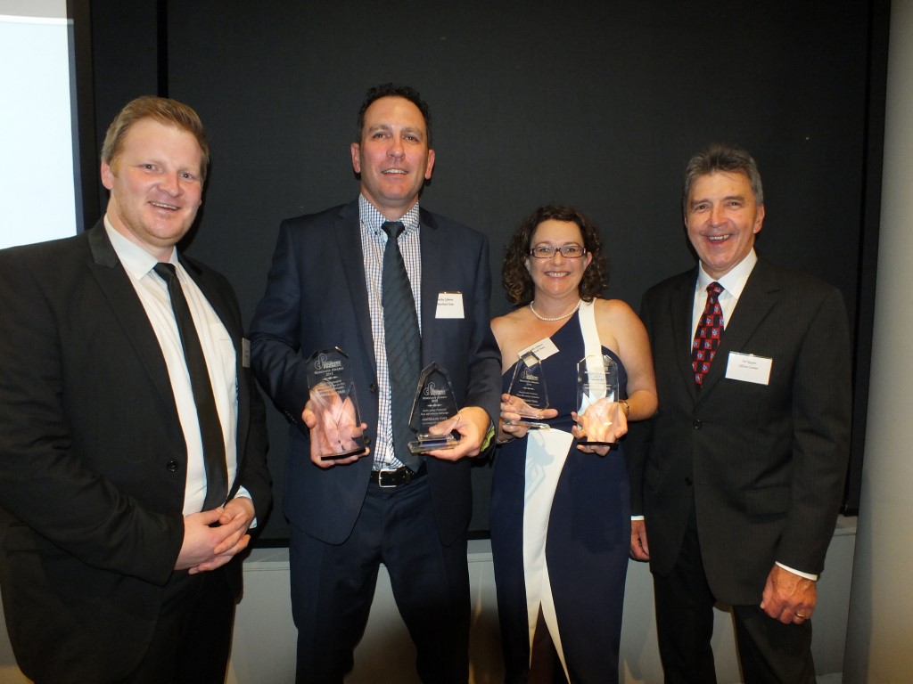 Joel Clapham from Media Super with new president Ted Rogers (right) at the Queensland Country Press Association Annual Awards presented trophies to Heatley and Michelle Gilmore, owners of the Community News