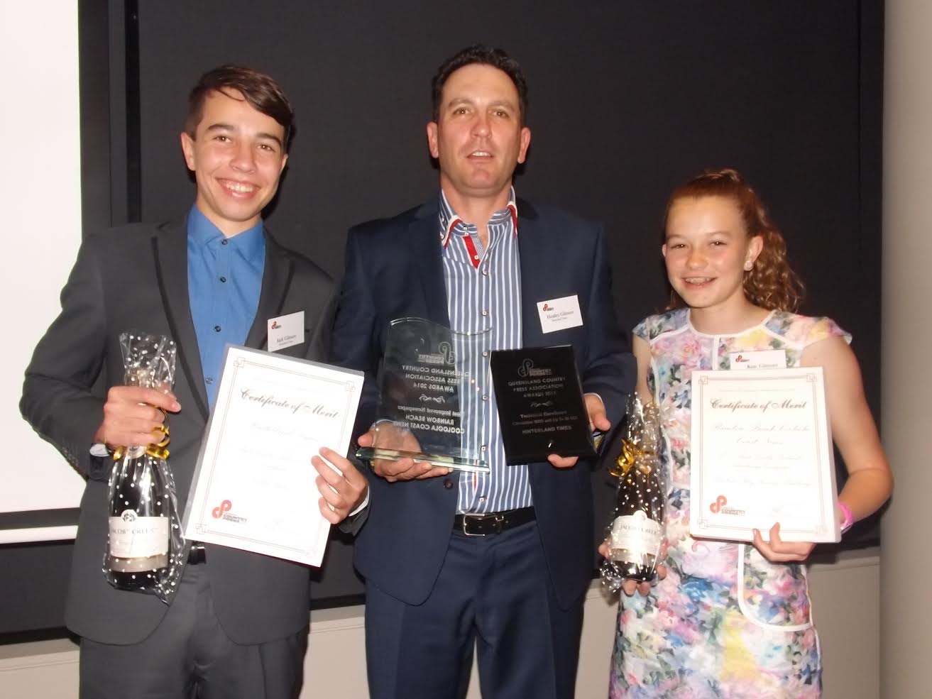 Heatley Gilmore with eldest two Jack and Kate with the “haul of takeaways" from the Queensland Country Press Association Awards Image courtesy Les and Adele Jasper