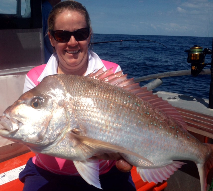 Michelle with her birthday present, a nice Snapper - photo from Double Island Point Fishing Charters
