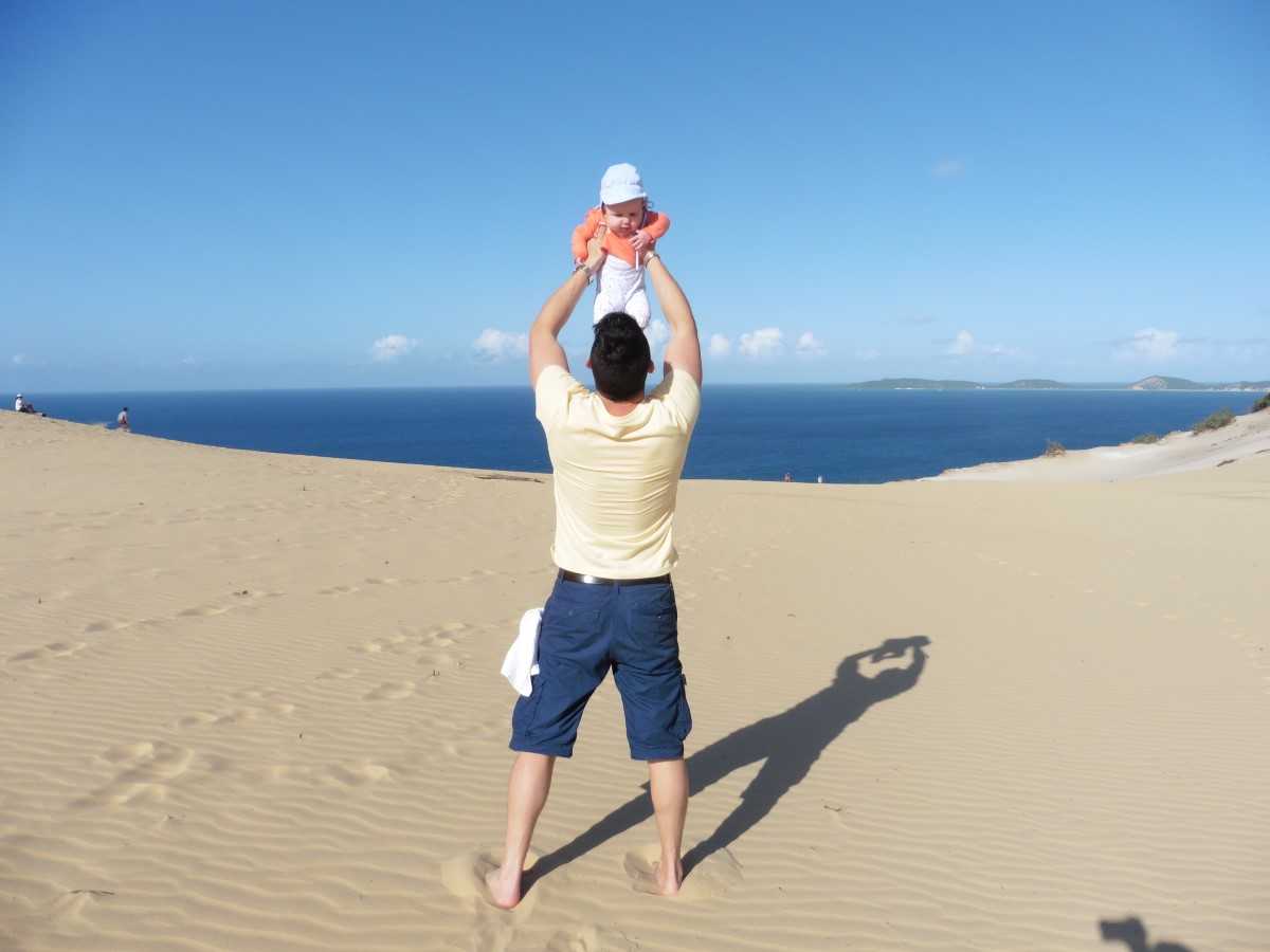 Editor Rhyll’s husband, Steve, was delighted to become a father six years ago - here he is celebrating his first ever Father’s Day by showing baby Silvie the sand blow