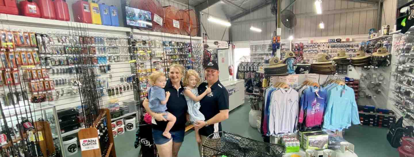 Owner of The Chandlery, Chris and Emma Rippon with their children in the business they have transformed at the Marina, Tin Can Bay