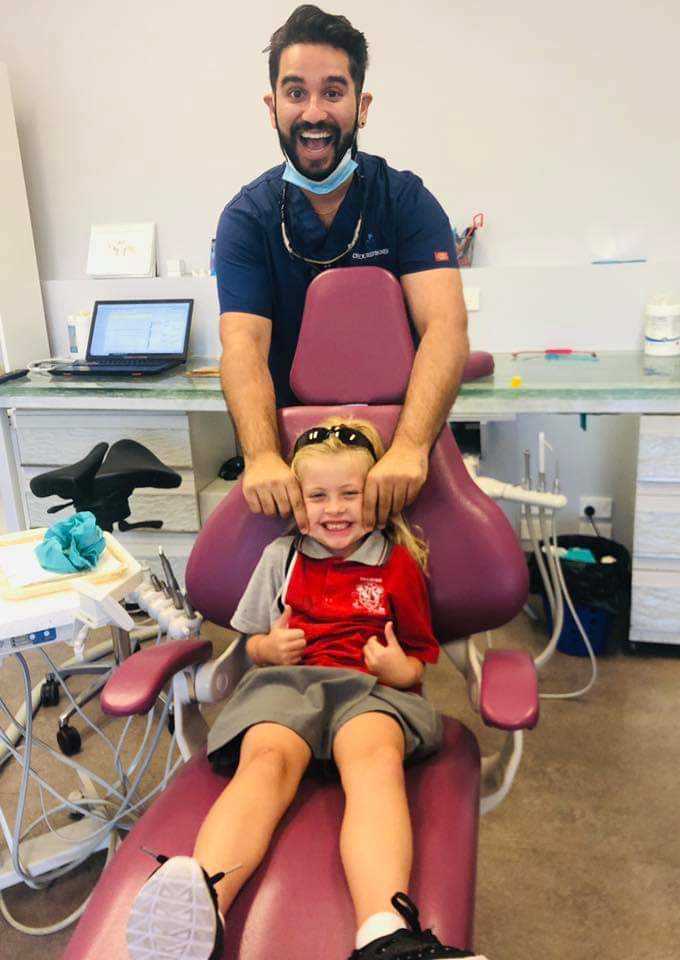 It is all smiles for Dentist Joel Pavy and Izzy Antrobus because eligible families receive free dental with NO GAP!