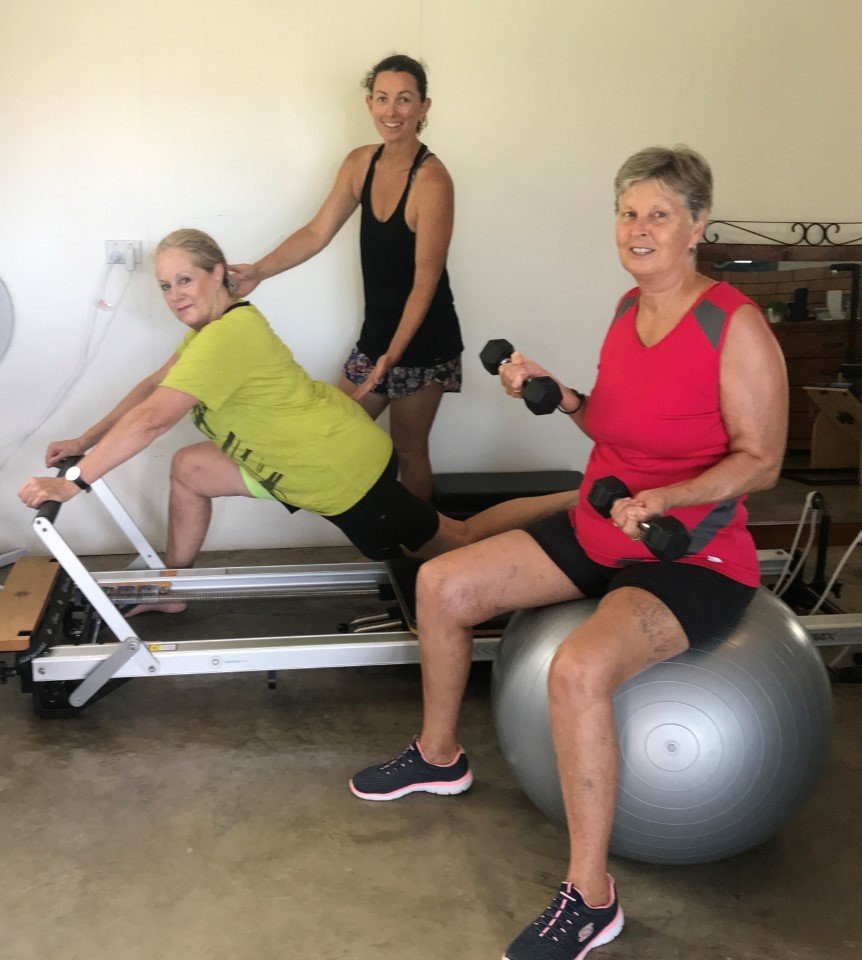 Heather Parker using the Pilates Reformer to release tight areas and strengthen weak places, with Sarah Booth, Pilates and pe