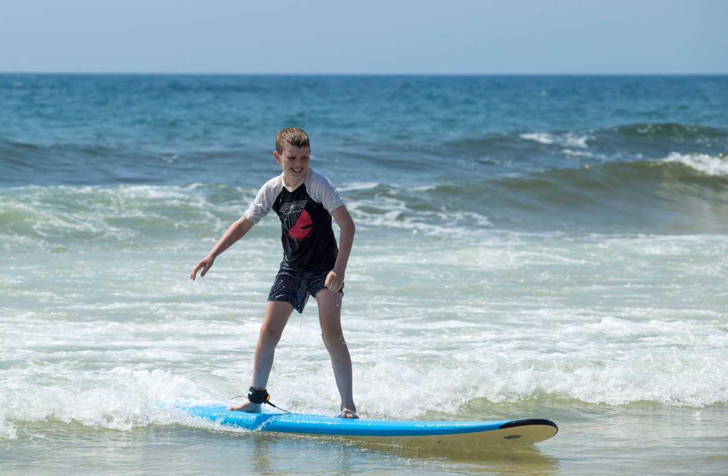 Riley’s first lesson - you can learn too with a kids’ Surf School in January