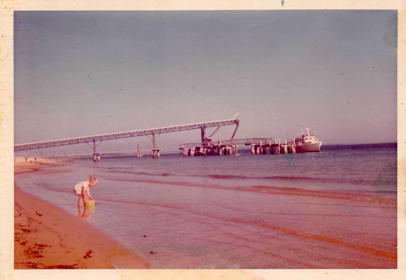 Ian Dean - Mineral sand jetty on Fraser island with a young Tony Dean in the foreground – 1974 