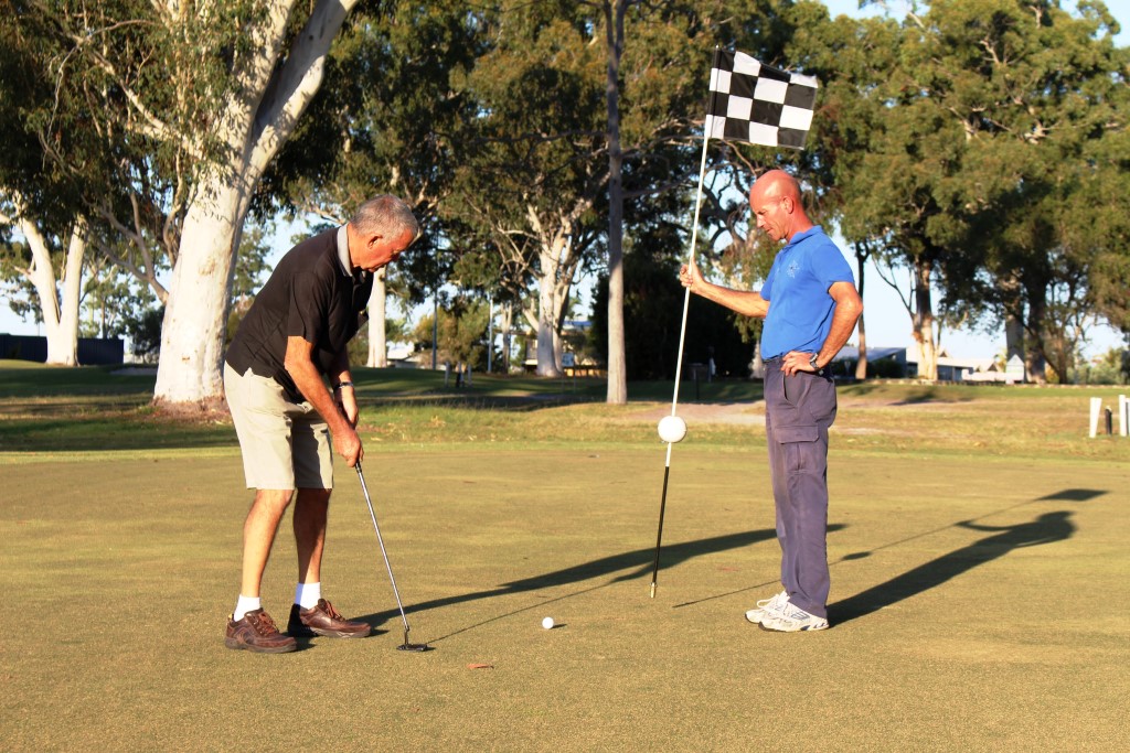 Mark Southern and President Phillip Davey are sneaking in some practise for the Lions Annual Charity Golf Day