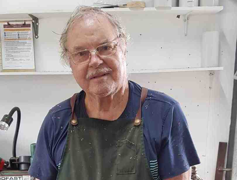 Shed member and lathe master Paul Oliver, showing rolling pins made at the Shed and ready for sale at the TCB Markets