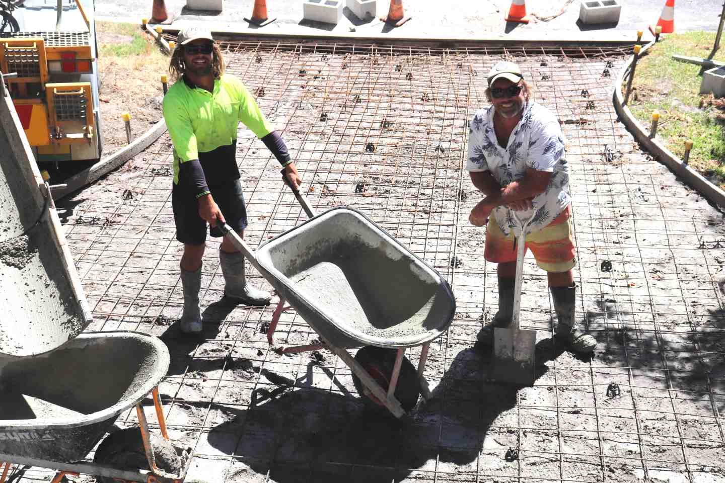 Mick Bourke and Terry Van Oirschot from MGB Concrete crafting another driveway to add to their impressive list on the coast