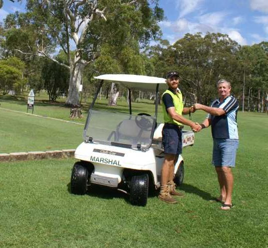 Dustin Carne, the new greenkeeper at Tin Can Bay Country Club, is welcomed by Mick Hall, who retired from the role after 25 years service