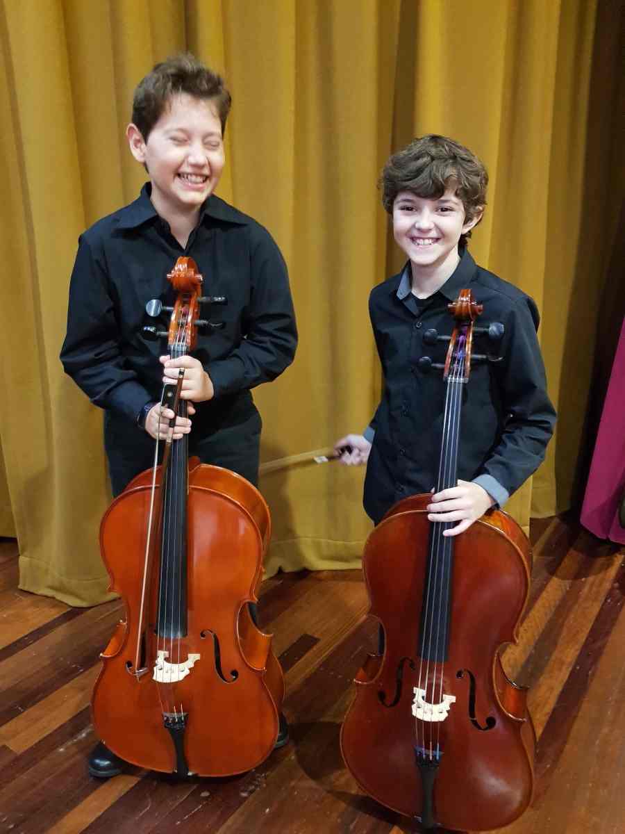 Cheeky young talents Bailey and Callum ready to rock at the recent Cooloola Community Orchestra concert