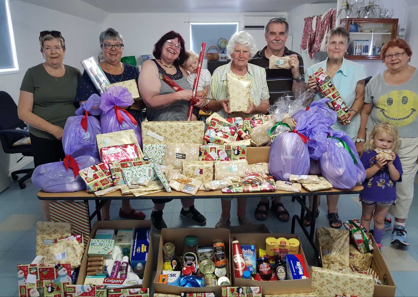 The QCWA team proudly display the gifts, groceries and food destine for drought affected families for Christmas 
