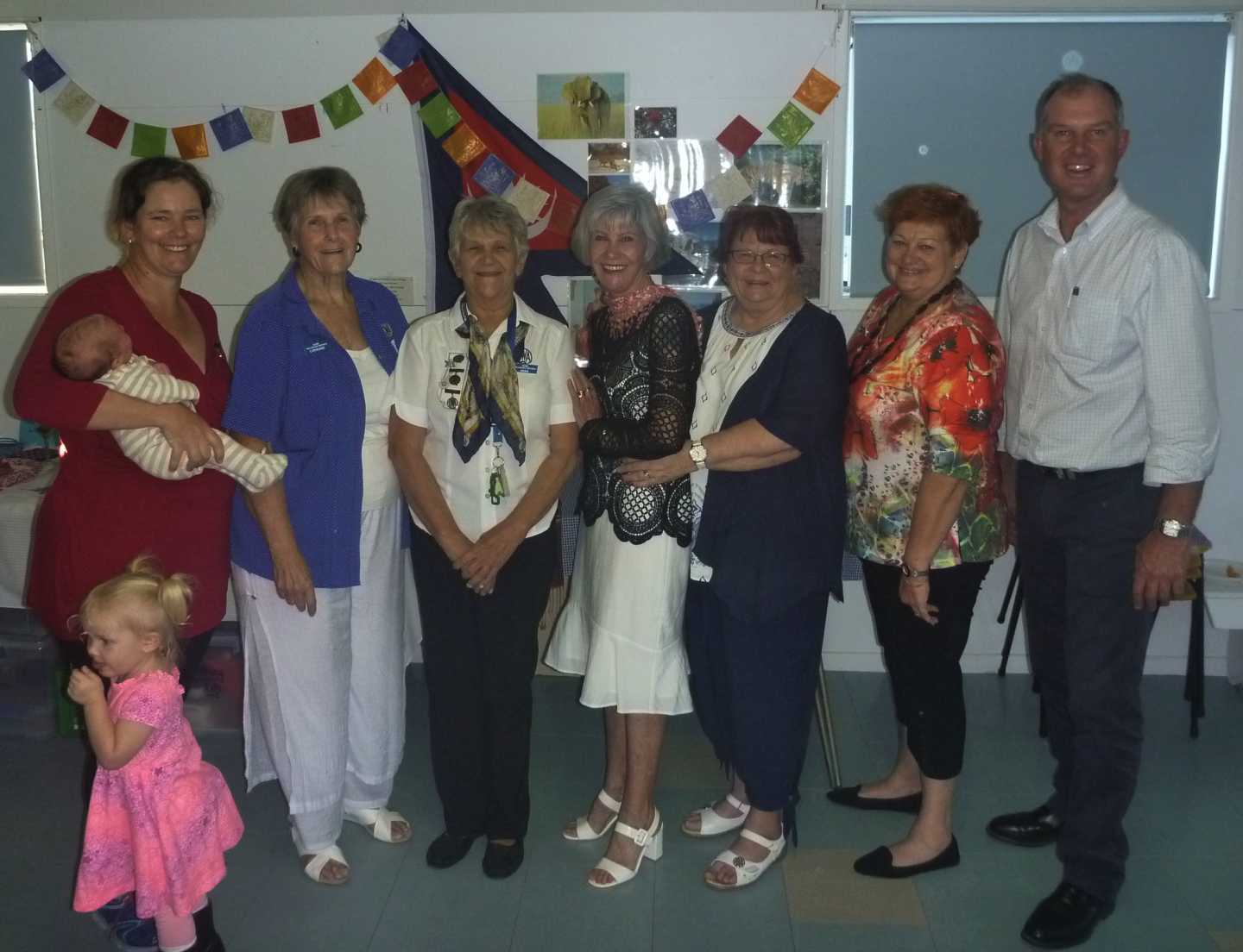 The new QCWA Tin Can Bay Branch Executive, Publicity Officer - Jess Milne with daughters, baby Jackie and Bonnie; International Officer - Lorraine Bishop; President - Joan Barnier; Secretary - Susan Spencer; Cottage Convenor - Linda Murphy; Vice President - Irene Manwaring are congratulated by MP Tony Perrett (Absent: Treasurer-  Jill Facer and Vice President - Diana Carroll)