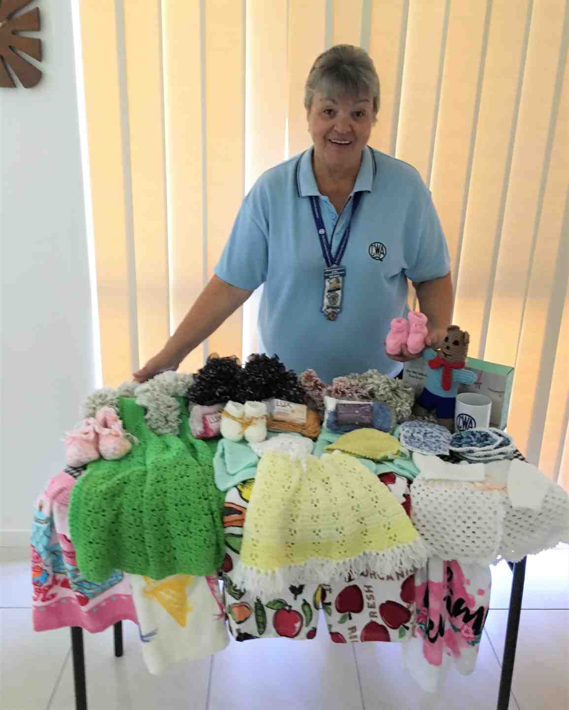 QCWA President Wendy receiving handmade items made by members going to those in need - great work ladies of the QCWA