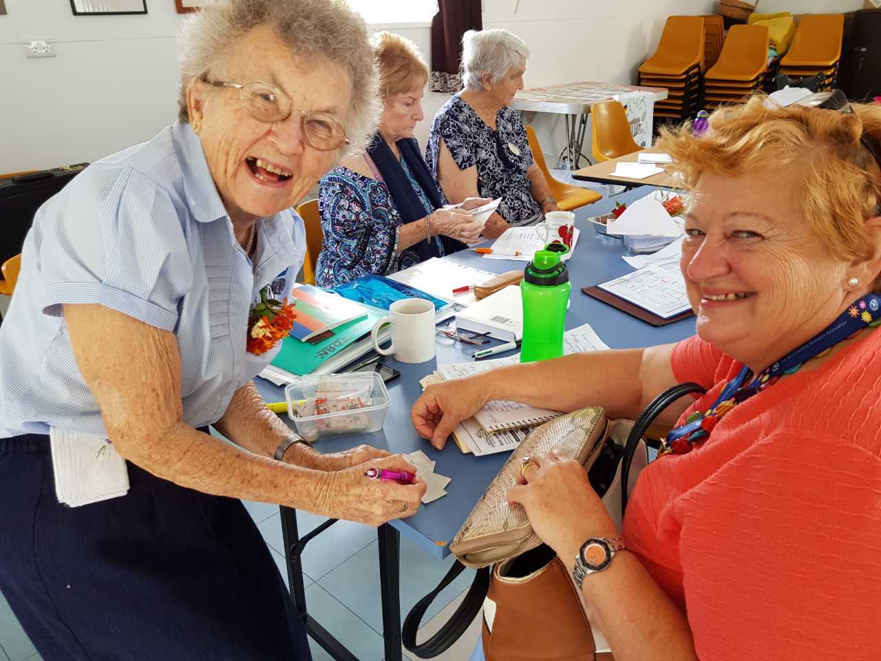 Elwin Sawyer and Irene Manwaring share a smile at a general meeting 