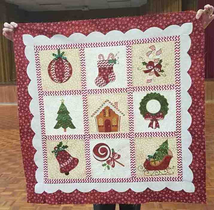 Can you identify this Tin Can Bay quilter who has made this beautiful Christmas quilt?