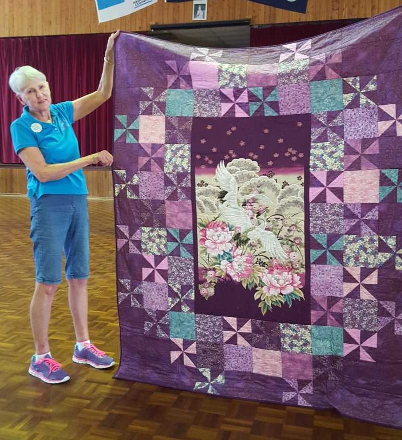 Sandra Bonnell and her beautiful quilt