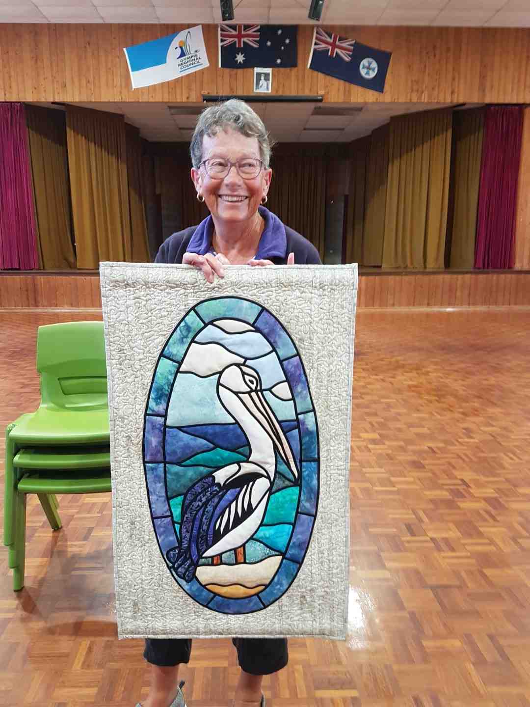 One of the new members of Tin Can Bay Quilters, Glenys with her quilt titled Pelican Pete