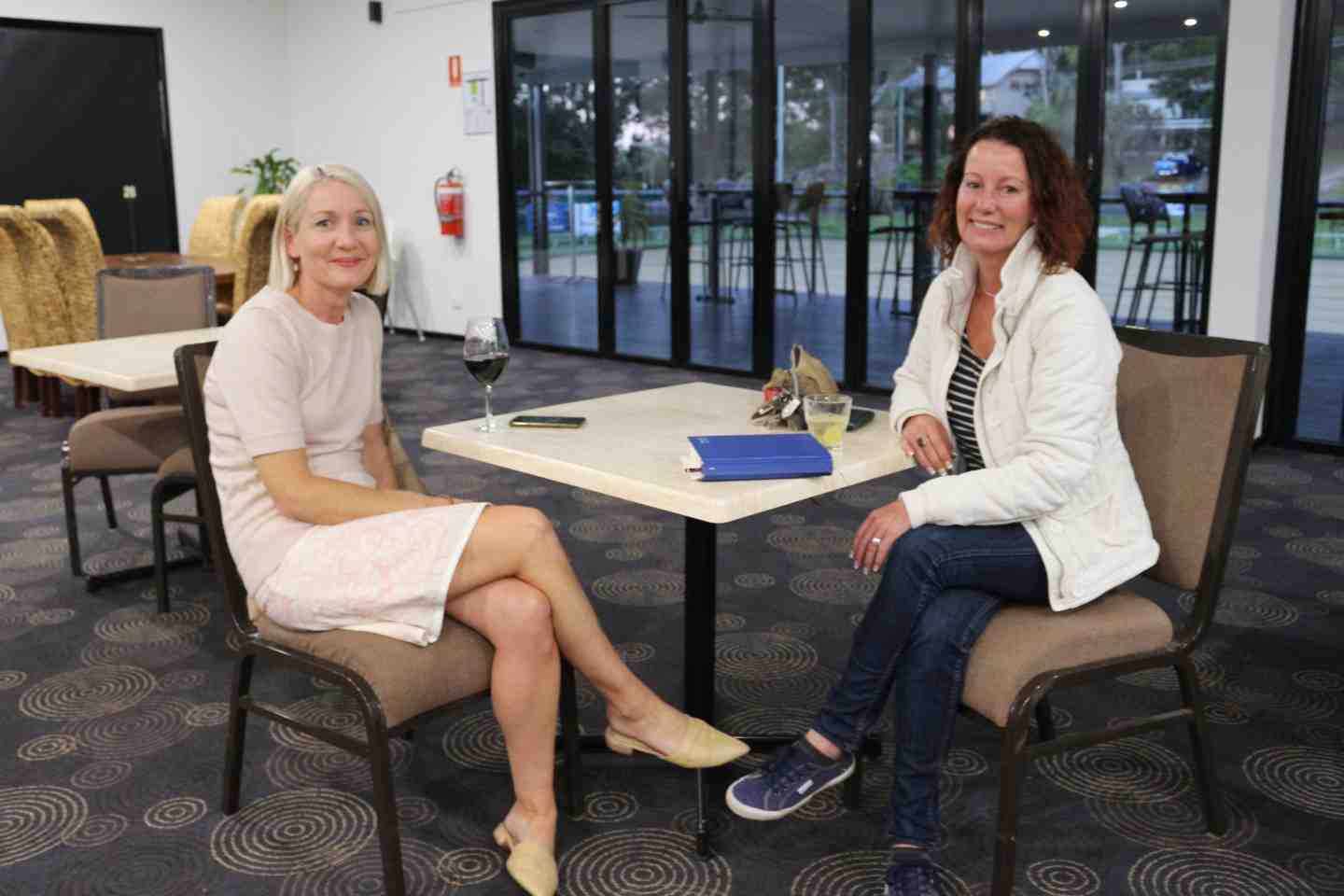 Natasha Dimmock of Natasha Leigh Properties and Stay Rainbow Beach, with Samantha Sullivan from mobile hair salon Gypsy Barberess, enjoying the Rainbow Beach Chamber meeting last month