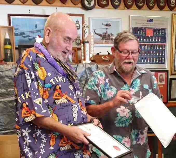 Terry Steele receiving his life membership certificate from TCB RSL President, Don Holland