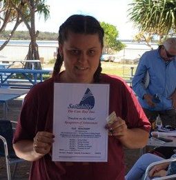 Ella Beauchamp with her Certificate of Achievement from Sailability at Tin Can Bay