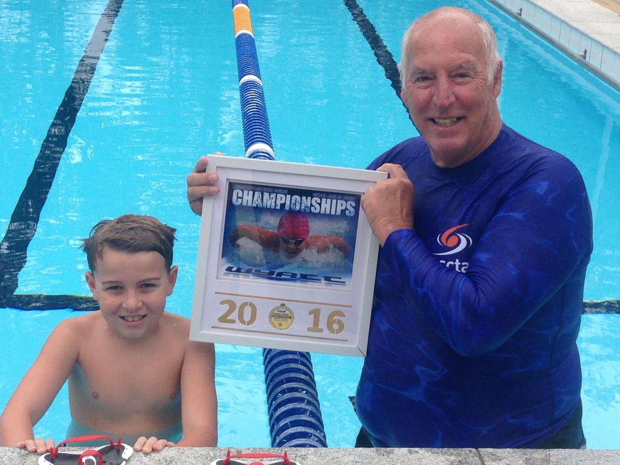 Wyatt Lee has had an awesome winter of swimming with an  outstanding effort at Queensland State Championships last month, pictured with Crocs coach, Greg Rogers