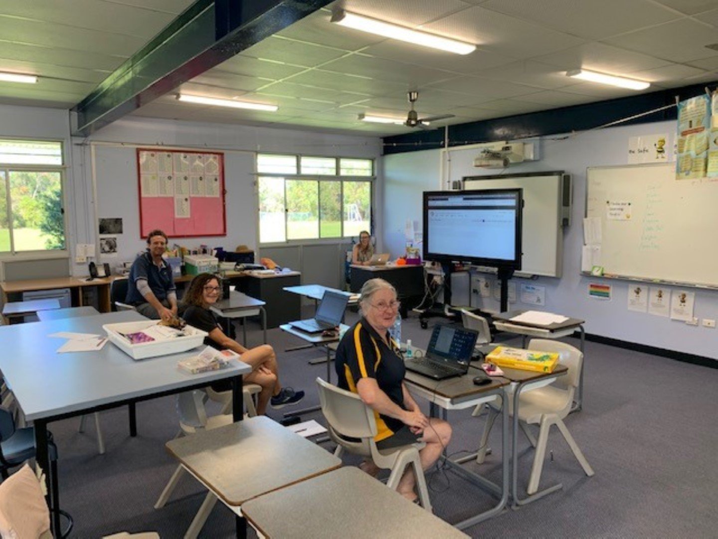 Teachers working together Lynne Chamberlain, Janine Lawler, Tina McColl and Peter Mileson preparing online learning 