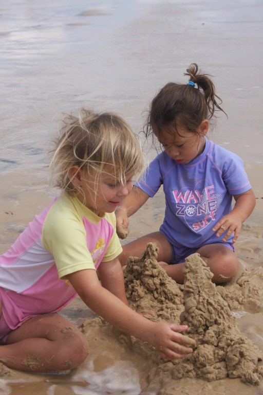 Slip on a shirt, slap on sunscreen…. Kiara Craig and Zia McPherson have fun in the sun