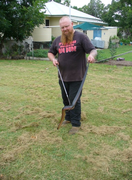 David Beck is the only qualified person on the Cooloola Coast to remove snakes, here he is with what he calls a “beautiful red-belly black” 