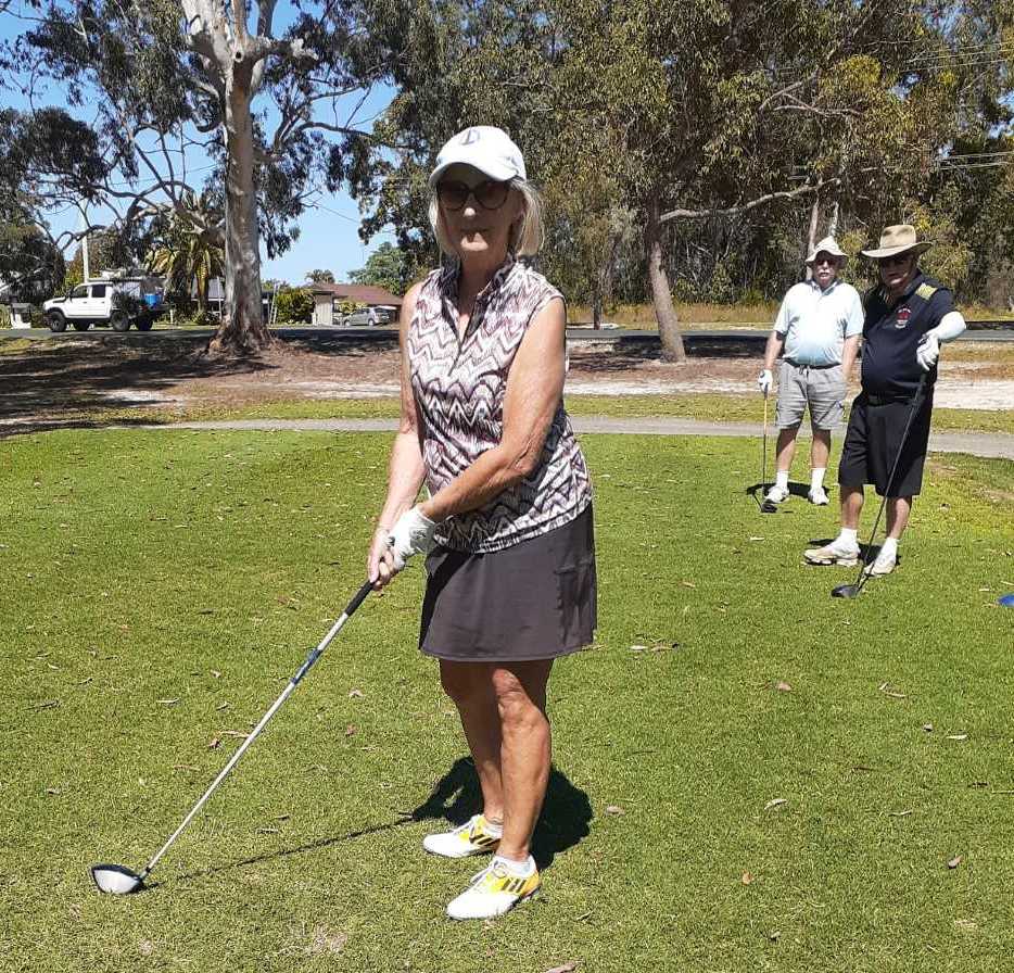 Jenny Skuja teeing off, with Barry Hudson and Lindsay Cullen watching