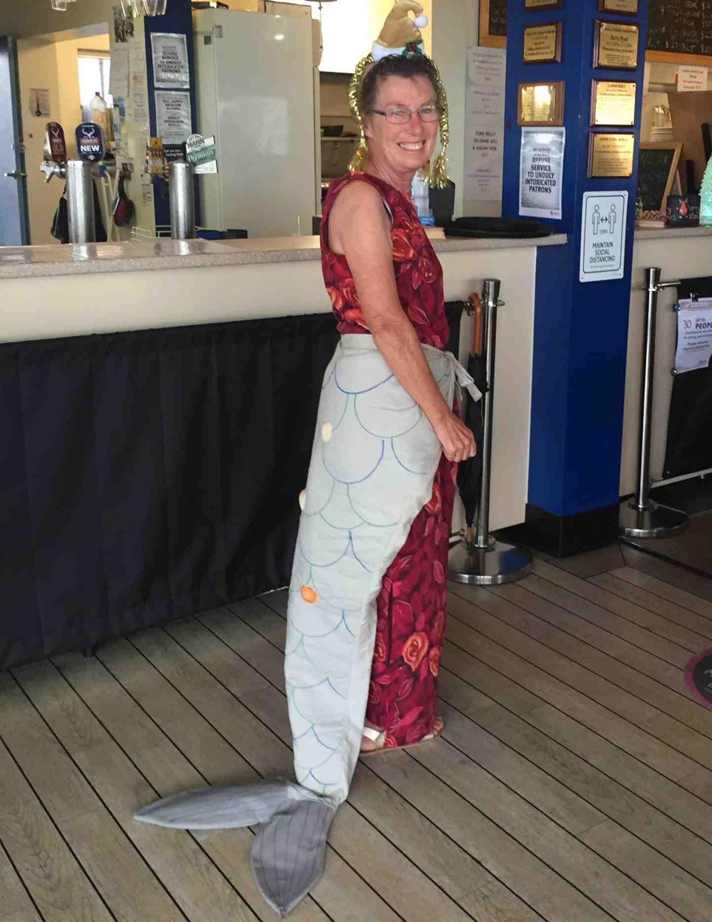 Yachtie and Dragon Kay Muir in her ‘Tails’ fancy dress costume at the Dragon Yacht Club Christmas Party at Tin Can Bay