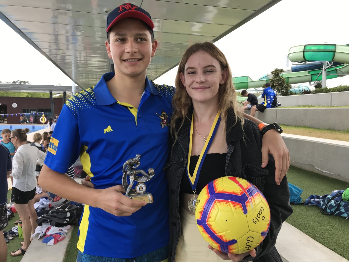 Rainbow Beach residents Archie Gilmore with his Player’s Player trophy for Under 14 Men and Abbey-Rose Cairns who won the Golden Boot prize for most goals on her team at the Gympie United Football Club Presentation