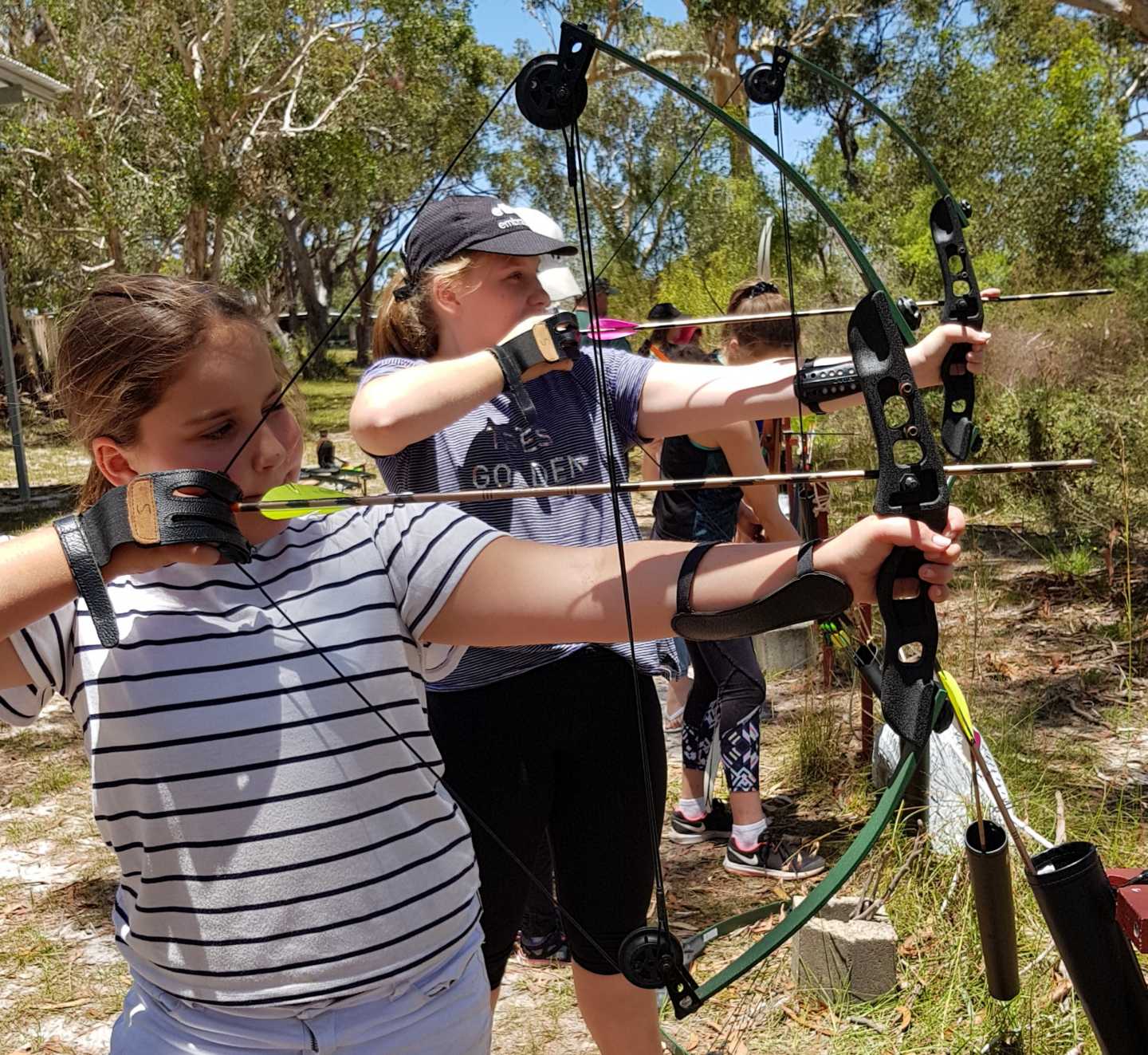 The O'Neil sisters from Brisbane try their hand at archery from last YAP activity day