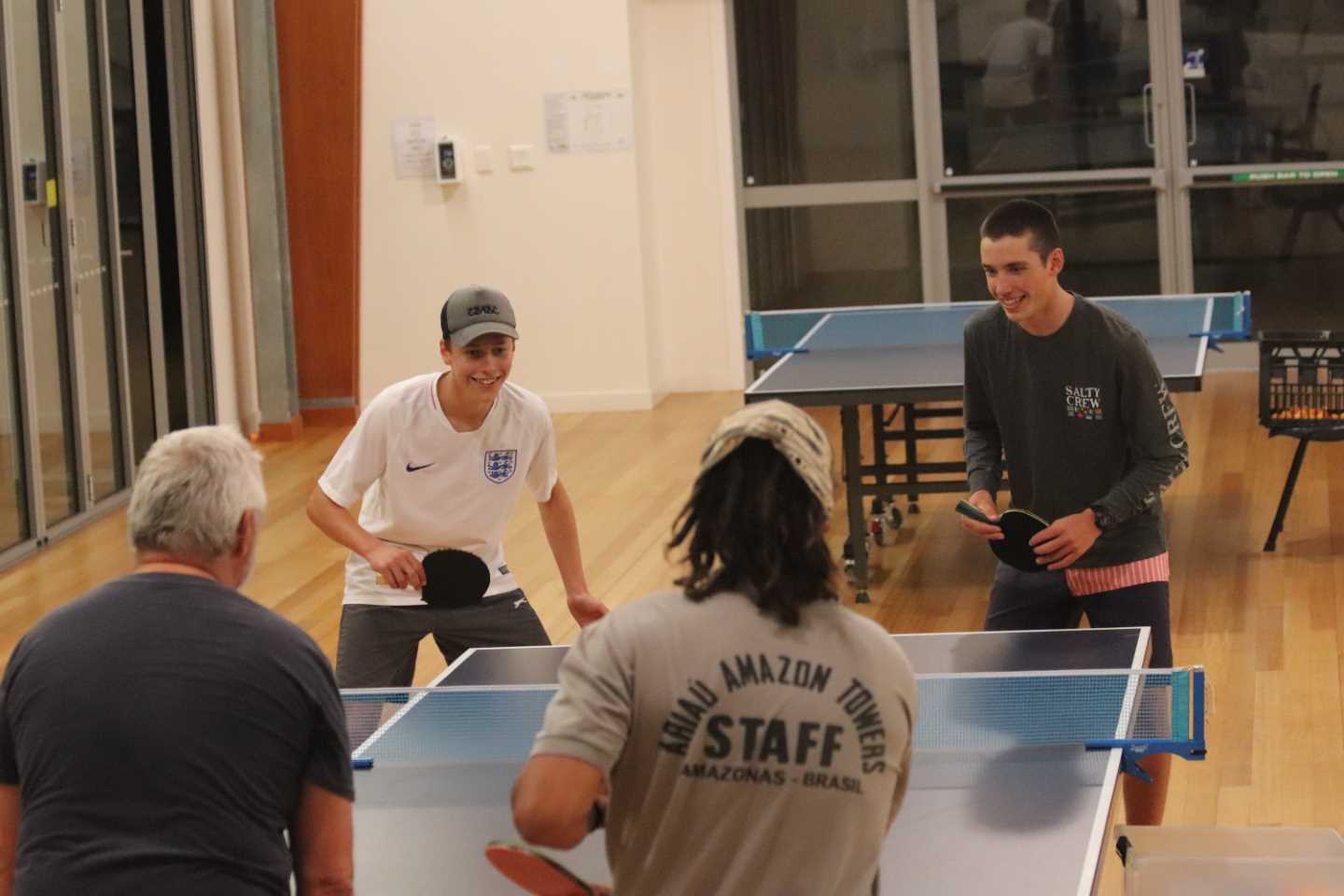 Youngsters James and Alex vs older residents, Peter and Daniel: all ages are welcome at table tennis