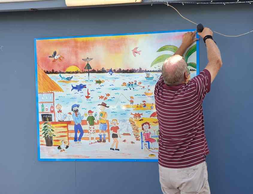 Vice Commodore John installs the Yacht Club’s new sign
