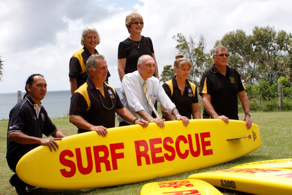 Surf Club members Helen Brown, Glenys Kidd (standing), Ray Wewer, Ron Organ, Debbie Cross and Ross Kidd thank Federal Member for Wide Bay and Deputy Prime Minister Mr Warren Truss (centre) for the federal grant win
