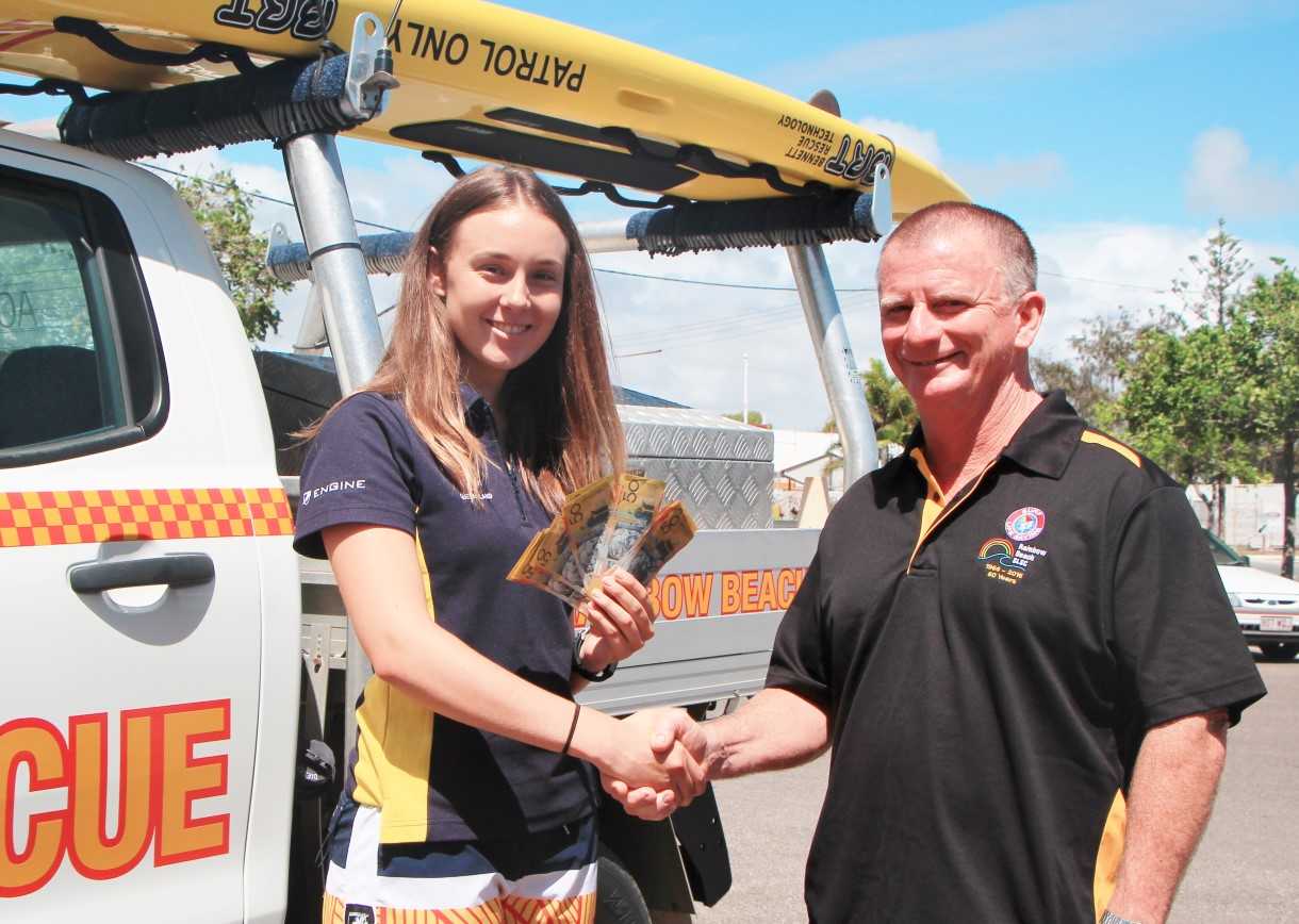 Summer Surf Girl, Elizna Smit, receives a very generous donation from PFD Foods, presented by Surf Club Supporters Club President, Mr John Greaney Image Barb Rees