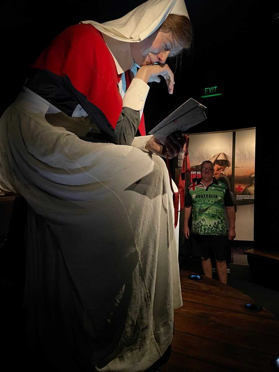 Article author Ross next to one of the exhibits (an ANZAC nurse) to show their monumental scale