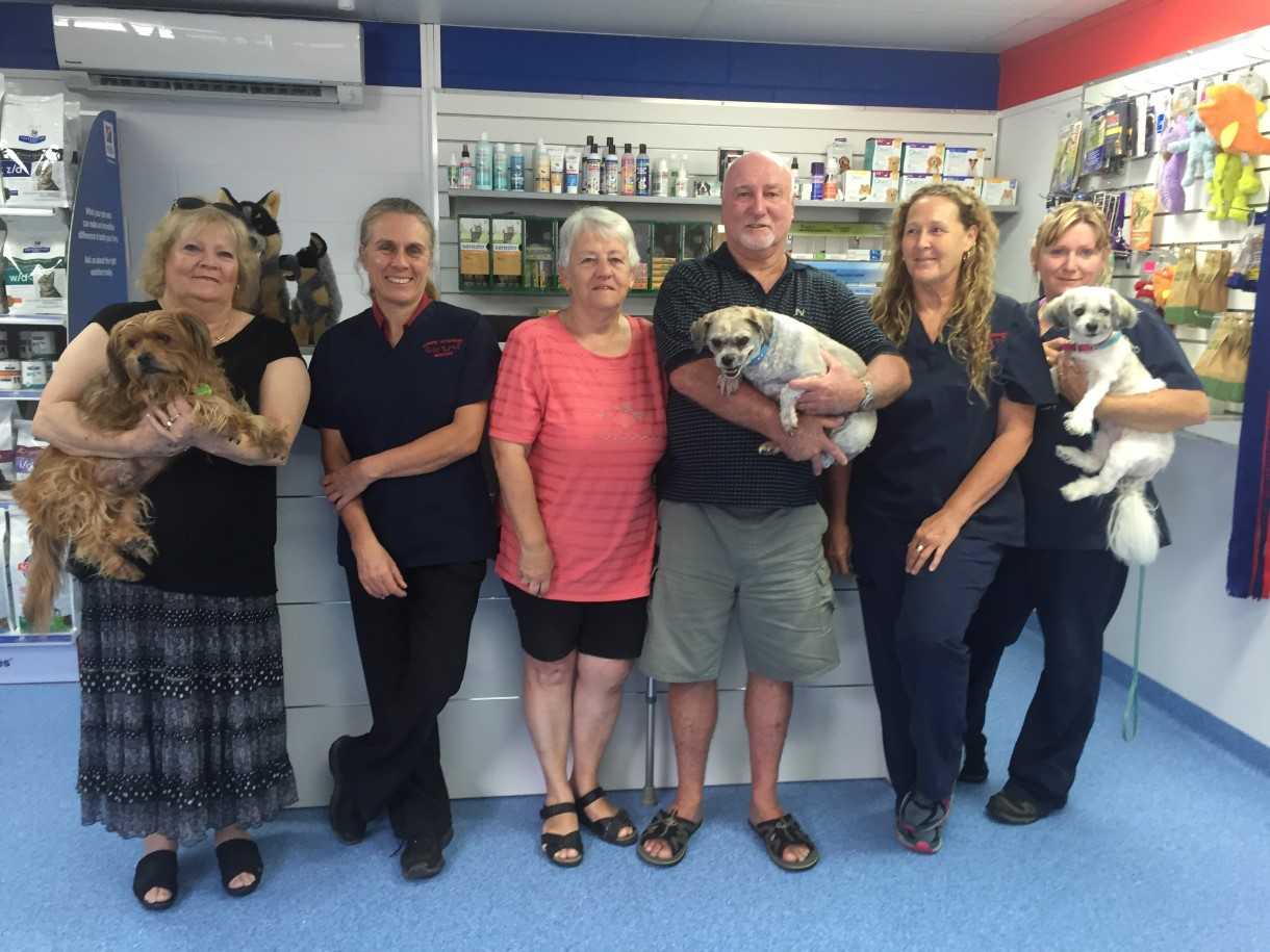 Jenny Eising with Buddy, vet Dr Cathy Milgate, Carol and Terry James with Scruff, team members Sandy Morton and Debbie Davey with Roxy