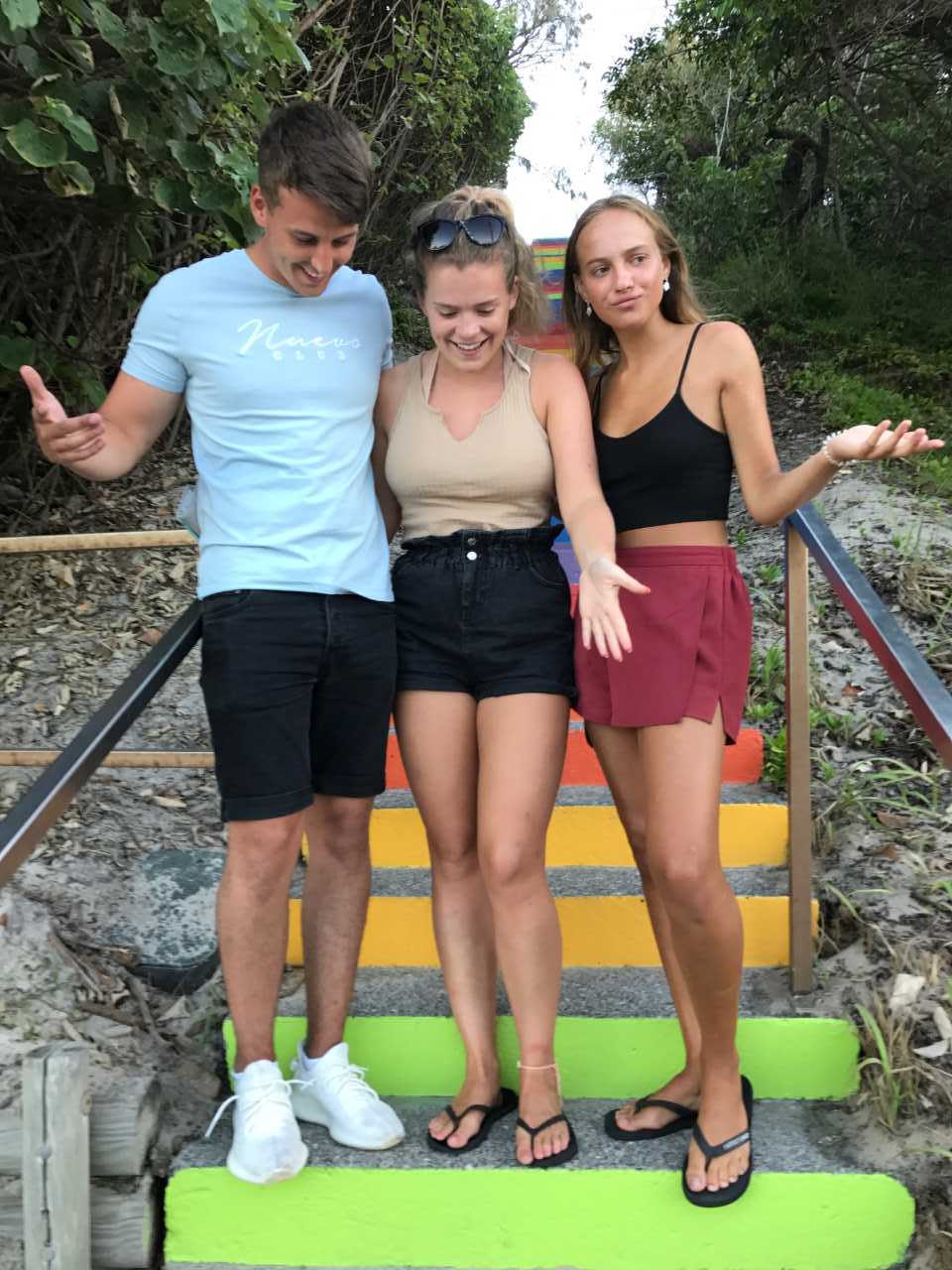 UK travellers, Elliot Pitt, Lauren Witherspoon and Hannah Earle visited the rainbow steps and want to know where are the words “How good is living”