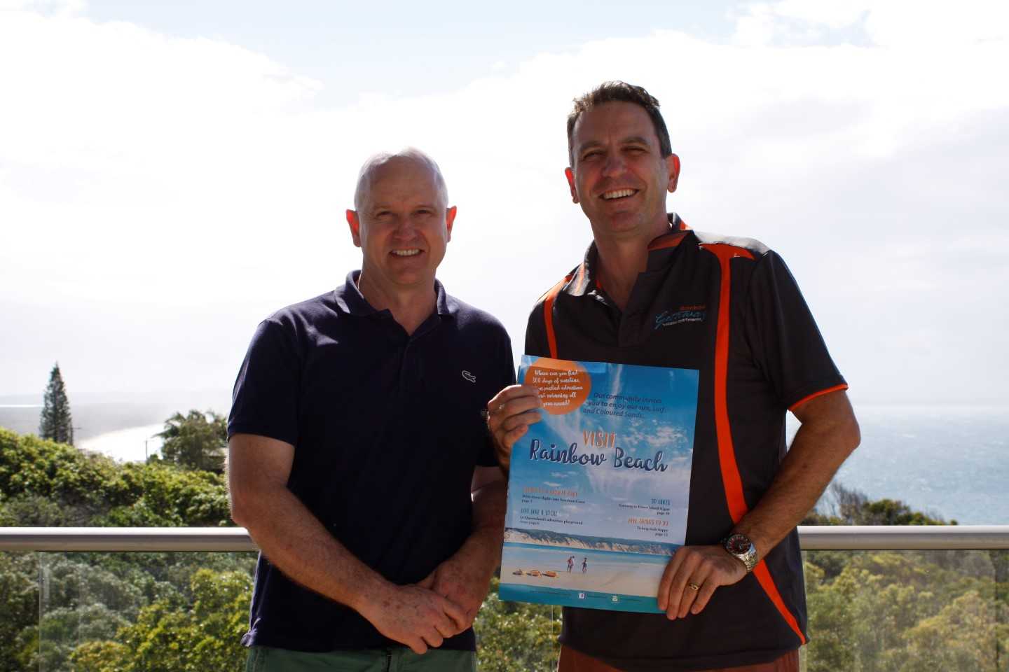 Mark Beech from Rainbow Ocean Palms Resort and Heatley Gilmore from Rainbow Getaway Holiday Apartments show off Rainbow Beach