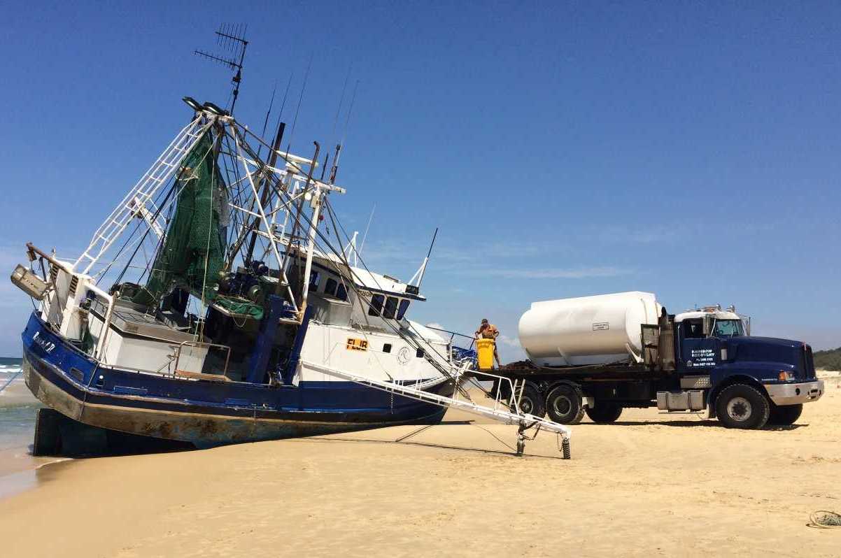 At low tide created a large hole adjacent to the vessel in an attempt to stand The Reward II upright before high tide Image Rainbow Recovery