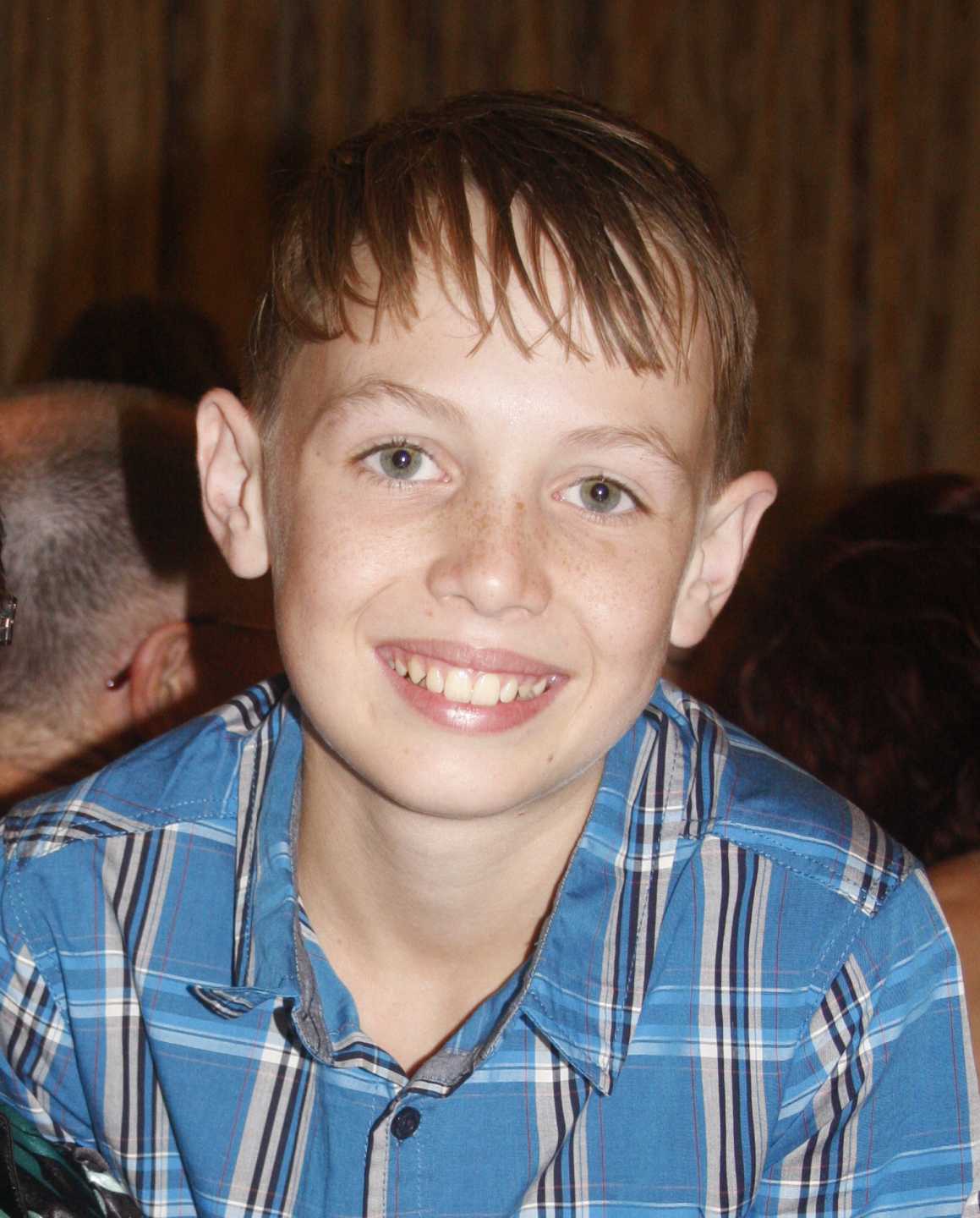 Tristan Sik remains in an induced coma, as prayers flow for his recovery (image from Rainbow Beach State School Grade 6 Graduation)