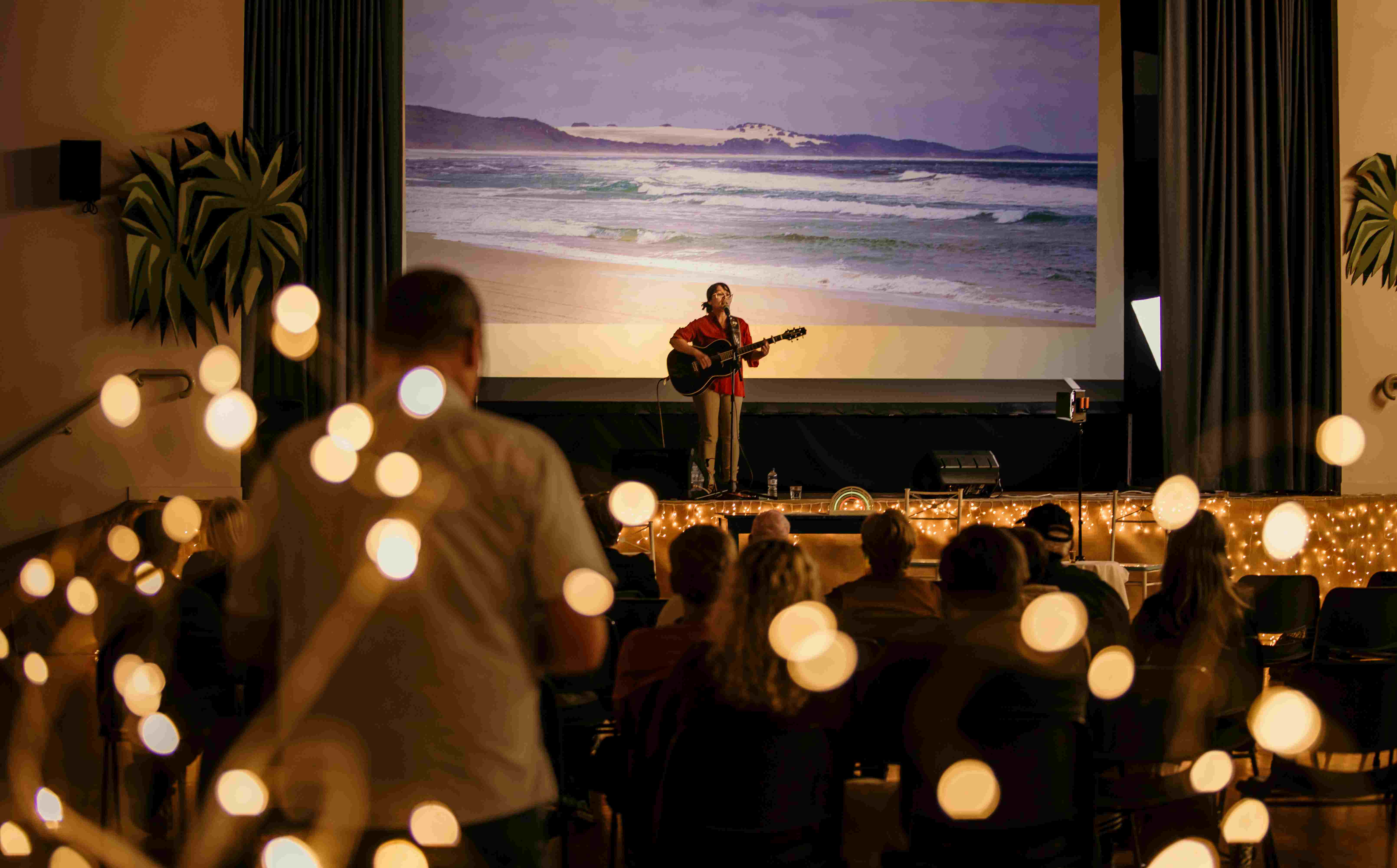 Sam Maddison on stage at the recent Tunes &amp; Tales. Cultural Waves will have a similar set up.